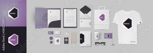 Full pack of corporate branding with geometrical minimal logo and stationery set of folder, personal card, envelope, notepad. Modern dark color style with violet and black