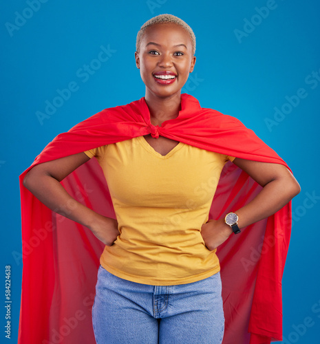 фотографія Black woman, superhero cape and portrait in studio, blue background and fashion