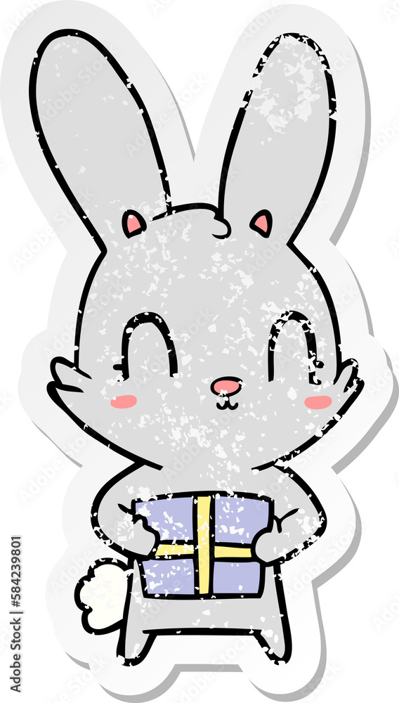 distressed sticker of a cute cartoon rabbit with present distressed sticker of a cute cartoon rabbit with present