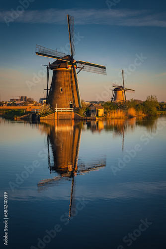 Morning among the windmills in Kinderdijk - one of the most characteristic places in the Netherlands. The beautiful spring adds charm to this place. © PawelUchorczak