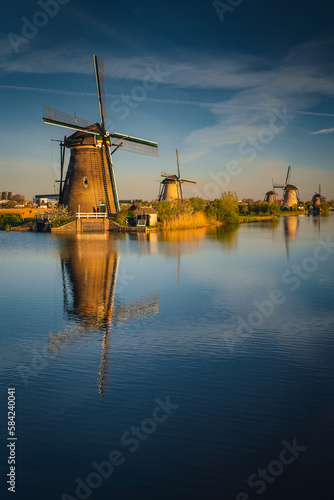Morning among the windmills in Kinderdijk - one of the most characteristic places in the Netherlands. The beautiful spring adds charm to this place. © PawelUchorczak
