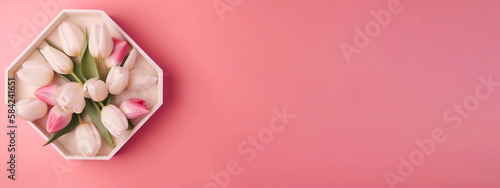 Pink and white tulips with gift box on pink pastel background © Thamidu