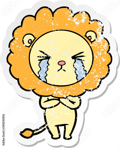 distressed sticker of a cartoon crying lion