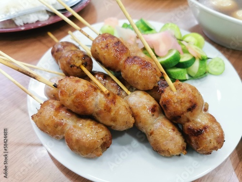 Delicious Thai esan sausage with cucumber and ginger it's popular Thai steet foods.