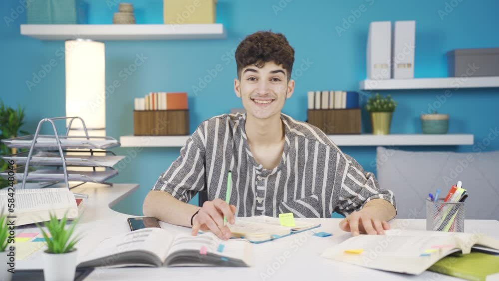 He is a very happy student to study.
Student studying at home looks at camera, laughs and makes a positive gesture.
He is a very happy student to study.
Student studying at home looks at camera, laughs and makes a positive gesture.