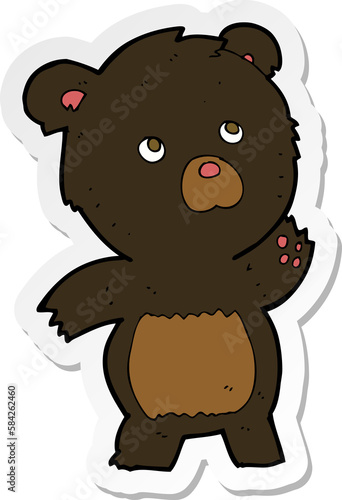 sticker of a cartoon curious black bear