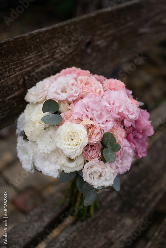 Wedding bouquet composed of roses, ozothamnus, freesia and eucalyptus. Pink bridal bouquet. Wedding day. photo