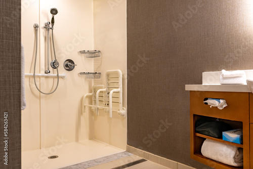 Принти на полотні Wheelchair accessible hotel bathroom shower with tile floor and walls