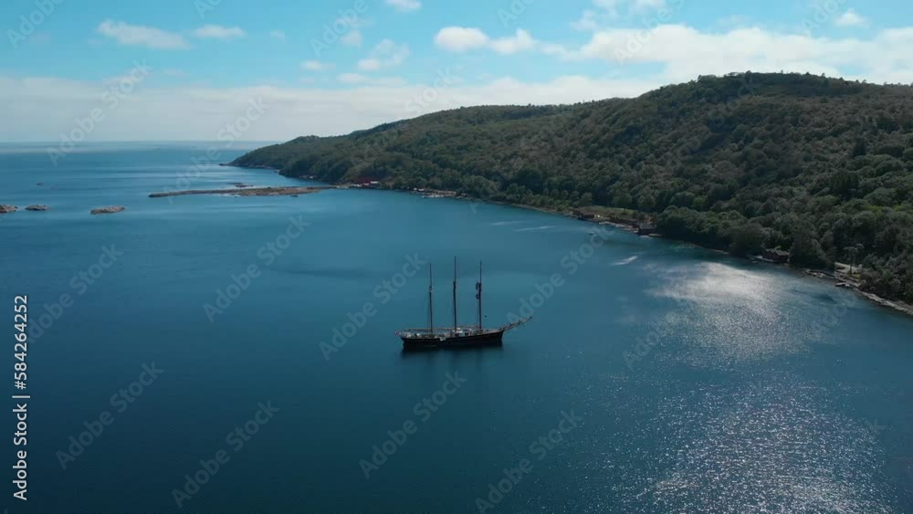 Drone shot of a three masted schooner in a fjord at summer Drone shot of a three masted schooner in a fjord at summer