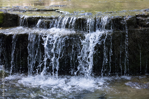 Fototapeta Naklejka Na Ścianę i Meble -  Natural waterfall over rocks