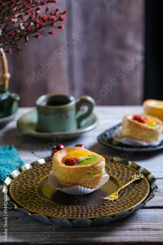 choux cream fruit, kue soes in dark background photo