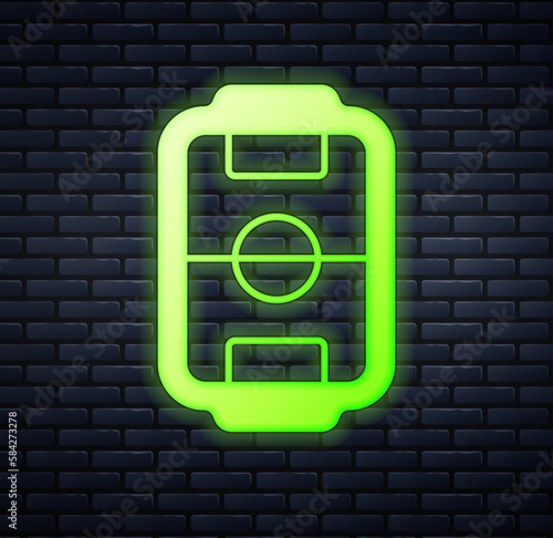 Glowing neon Table football game hobby or leisure icon isolated on brick wall background. Sport team football players. Vector