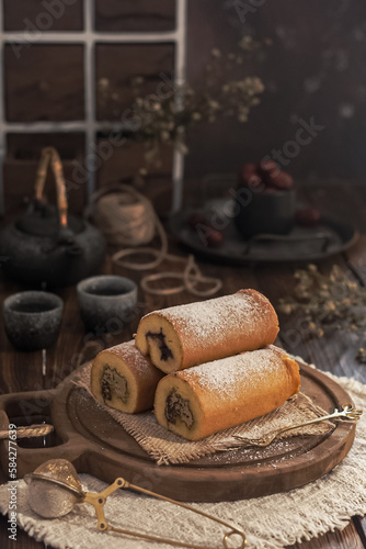 roll cake on a cutting board. rustic concept 