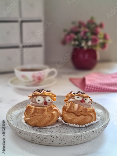 choux pastry in white ceramic plaste, kue soes photo