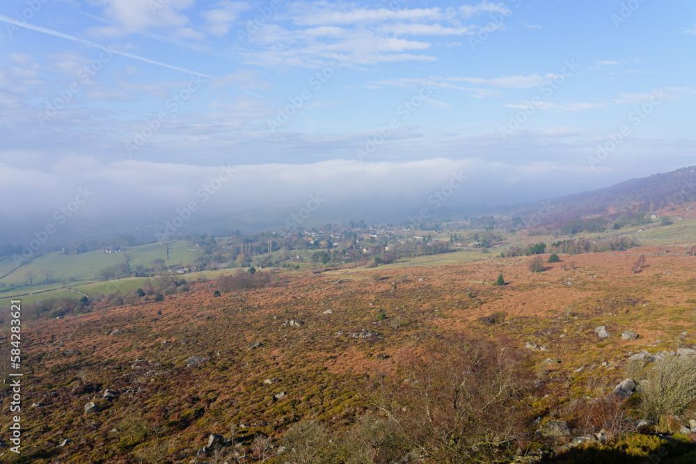 Low clouds creep across Curbar Village in the Hope Valley, Derbyshire. Low clouds creep across Curbar Village in the Hope Valley, Derbyshire.
