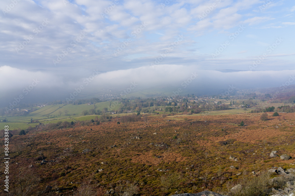Strange clouds sit over a foggy Hope Valley in the Derbyshire Peak District.