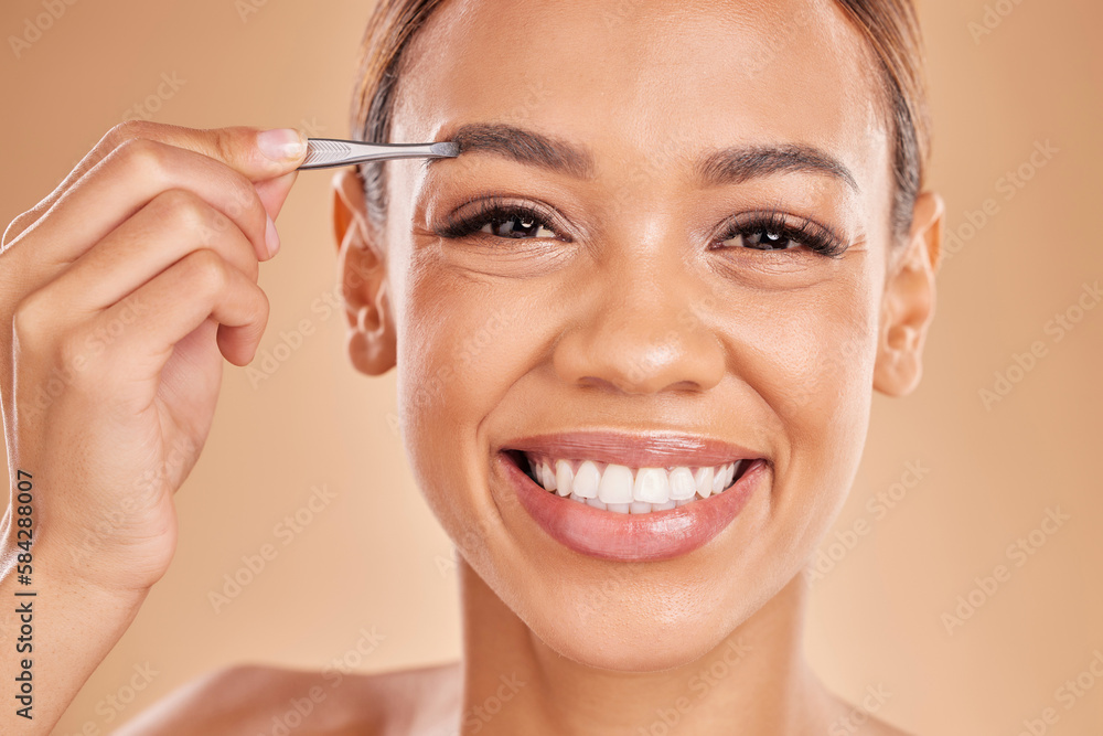 Woman, face and tweezer on eyebrow for skincare beauty, grooming or trimming against a studio background. Portrait of happy female tweezing eyebrows with big smile for facial cleaning or hair removal Woman, face and tweezer on eyebrow for skincare beauty, grooming or trimming against a studio background. Portrait of happy female tweezing eyebrows with big smile for facial cleaning or hair removal
