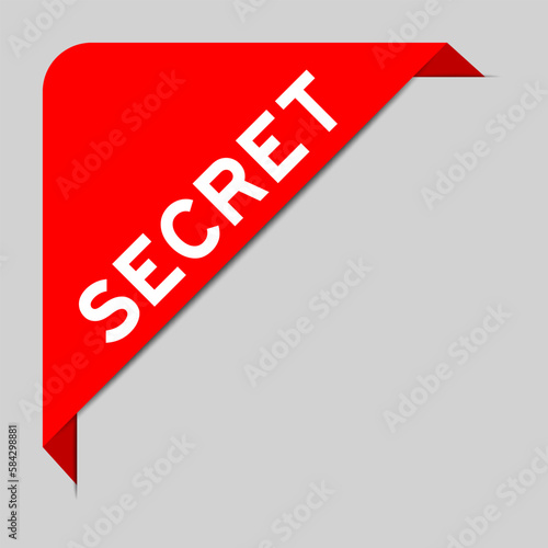 Red color of corner label banner with word sccret on gray background