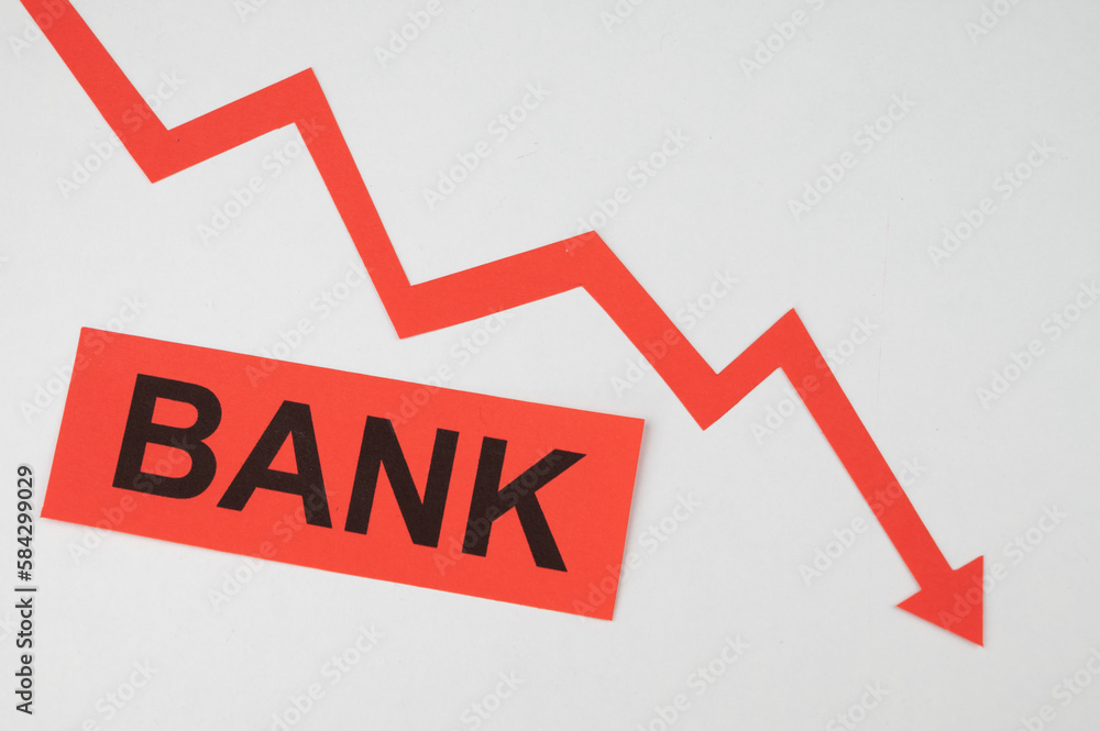 Descending red line, word Bank. Bank failure and economic and financial consequences. Collapse of yields.
Descending red line, word Bank. Bank failure and economic and financial consequences. Collapse of yields.