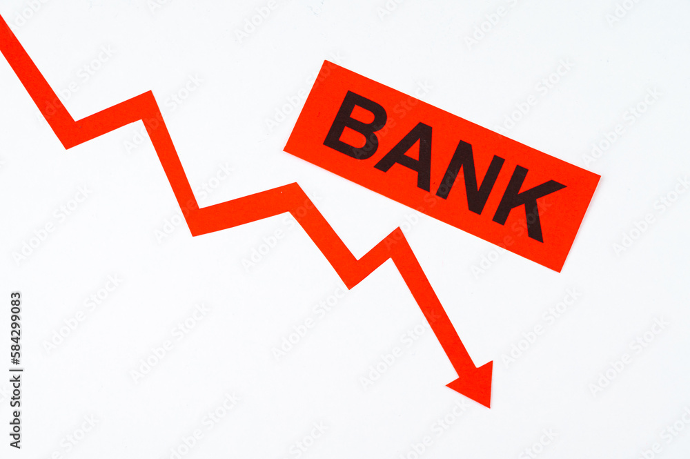 Descending red line, word Bank. Bank failure and economic and financial consequences. Collapse of yields.
Descending red line, word Bank. Bank failure and economic and financial consequences. Collapse of yields.