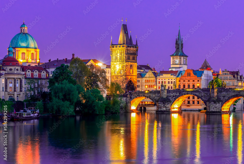Prague medieval architecture and Charles bridge over Vltava river at night, Czech Republic