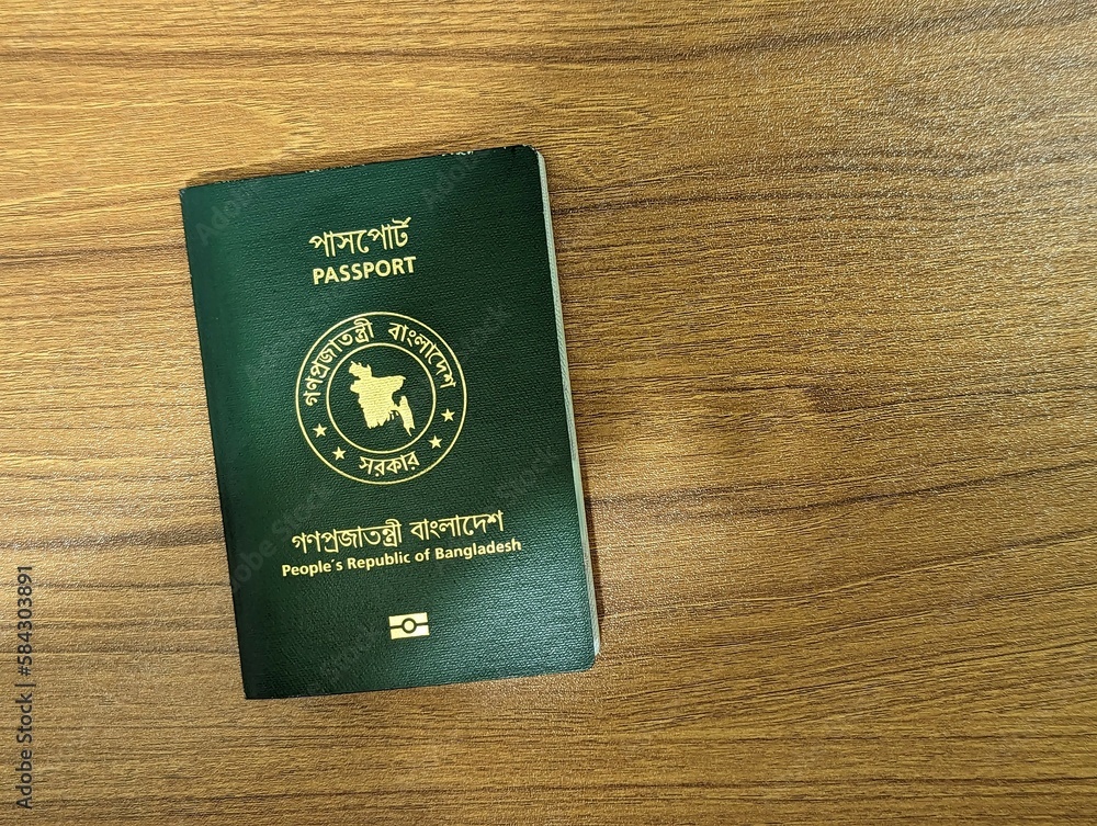 Bangladesh passport on a wooden background Bangladesh passport on a wooden background