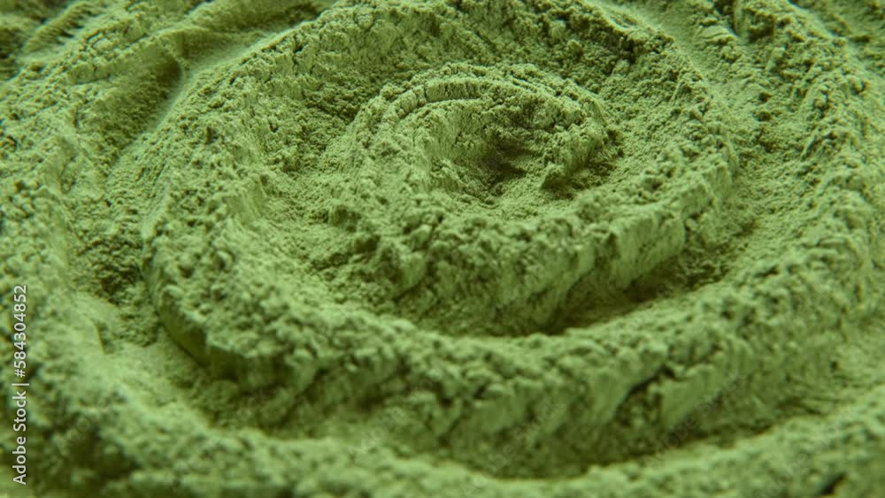 Chlorella or spirulina algae green powder is spinning, rotation. Dietary supplement to improve health. Seaweed superfood. Healthy food background. Vitamins and minerals to diet. Detox. Close up video. Chlorella or spirulina algae green powder is spinning, rotation. Dietary supplement to improve health. Seaweed superfood. Healthy food background. Vitamins and minerals to diet. Detox. Close up video.