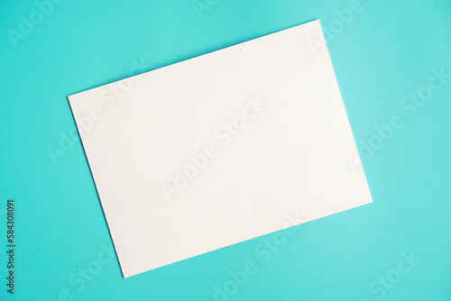 blank note paper on blue background