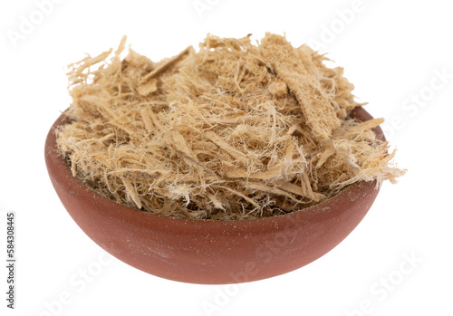 Small bowl filled with shredded slippery elm bark isolated on a white background side view.