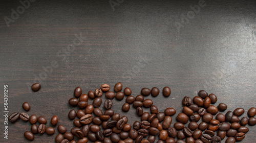 Coffee beans on wood background © Paveena