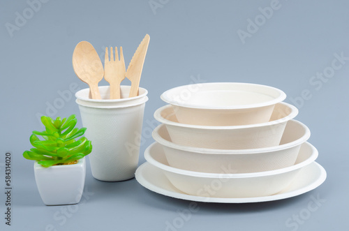 The Eco friendly biodegradable paper disposable for packaging food and paper glass on gray color background.