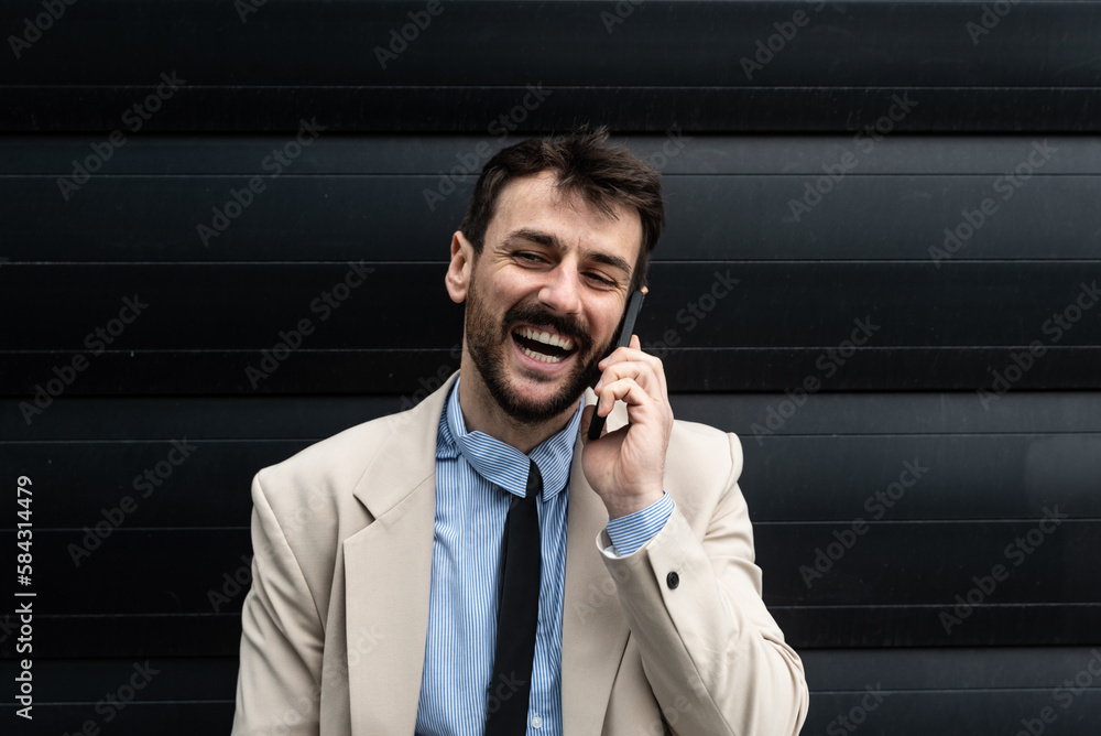 Portrait of young businessman outside the office building expert in global business and marketing, employee of a company for sale of stock shares and telecommunications. Successful business person Portrait of young businessman outside the office building expert in global business and marketing, employee of a company for sale of stock shares and telecommunications. Successful business person