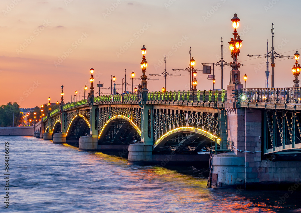Troitskiy (Trinity) bridge over Neva river at sunset, Saint Petersburg, Russia