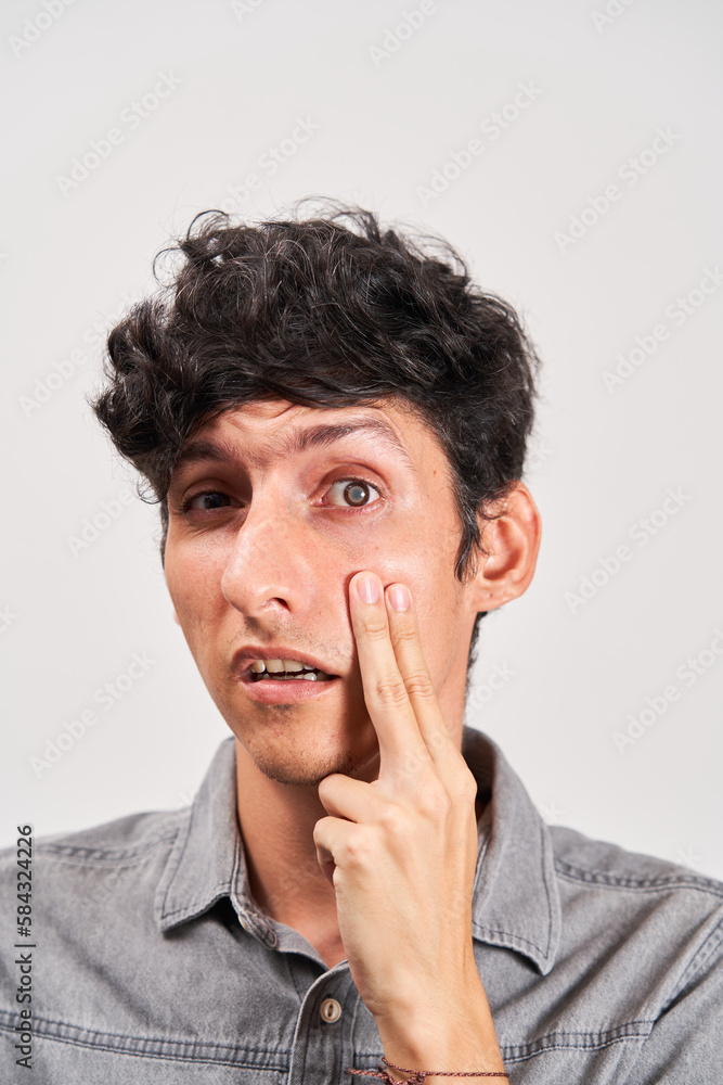 Young man has cataract checked in his eye. Young man has cataract checked in his eye.