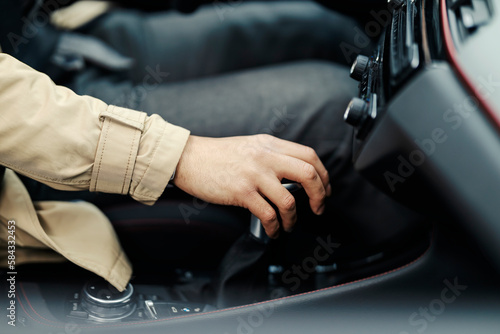 Close up of hand using transmission in a car. © dusanpetkovic1