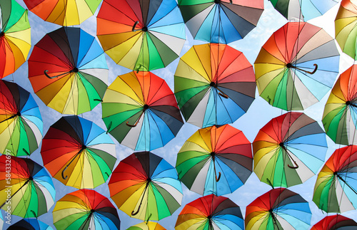 many colorful umbrellas against the blue sky