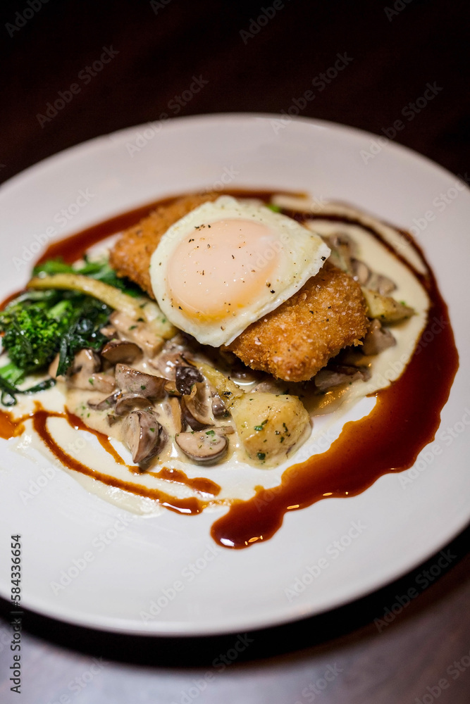 Schnitzel with a fried egg on top Schnitzel with a fried egg on top