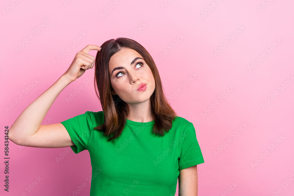 Portrait of cheerful nice woman with straight hairdo wear green t-shirt look empty space hand on head isolated on pink color background Portrait of cheerful nice woman with straight hairdo wear green t-shirt look empty space hand on head isolated on pink color background