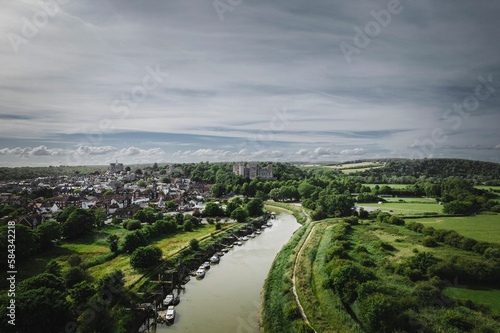 Aerial view of the River Arun surrounded by green vegetation. Arundel, West Sussex, England.