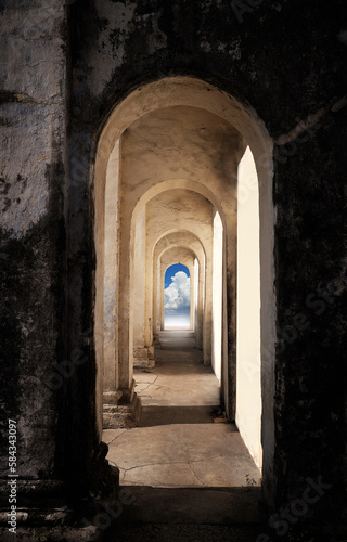 Heaven s gate. Dark tunnel corridor with arch opening to a beautiful cloudy sky. Light at the end of the tunnel.