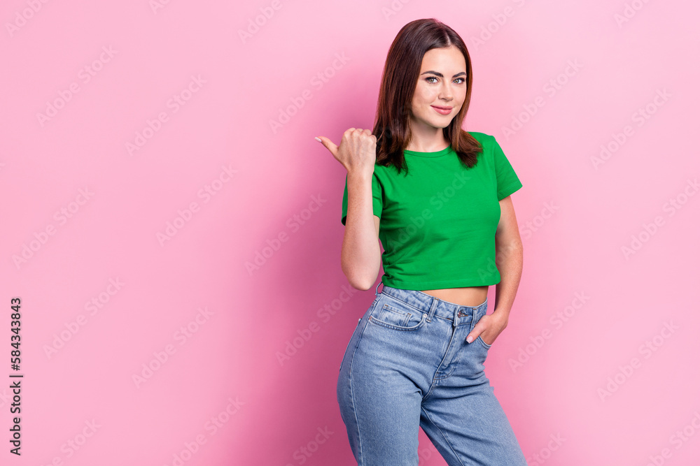 Portrait of gorgeous nice lady indicate thumb finger empty space offer isolated on pink color background Portrait of gorgeous nice lady indicate thumb finger empty space offer isolated on pink color background