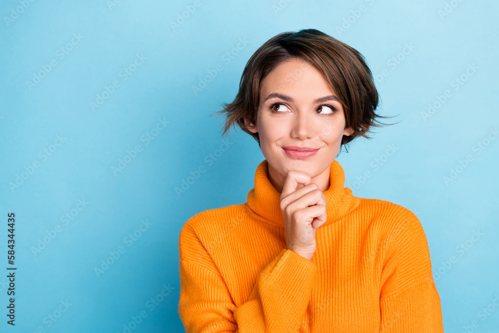 Portrait of creative gorgeous person arm touch chin look empty space brainstorming isolated on blue color background Portrait of creative gorgeous person arm touch chin look empty space brainstorming isolated on blue color background