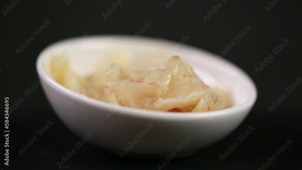 Closeup of a tasty salad with spices and salt isolated on the black background Closeup of a tasty salad with spices and salt isolated on the black background