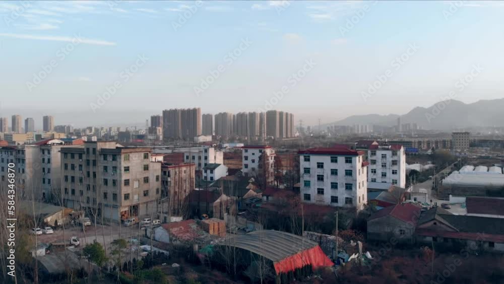 Aerial view of the cityscape on a sunny day with a cloudy blue sky in the background, Yiwu, China Aerial view of the cityscape on a sunny day with a cloudy blue sky in the background, Yiwu, China