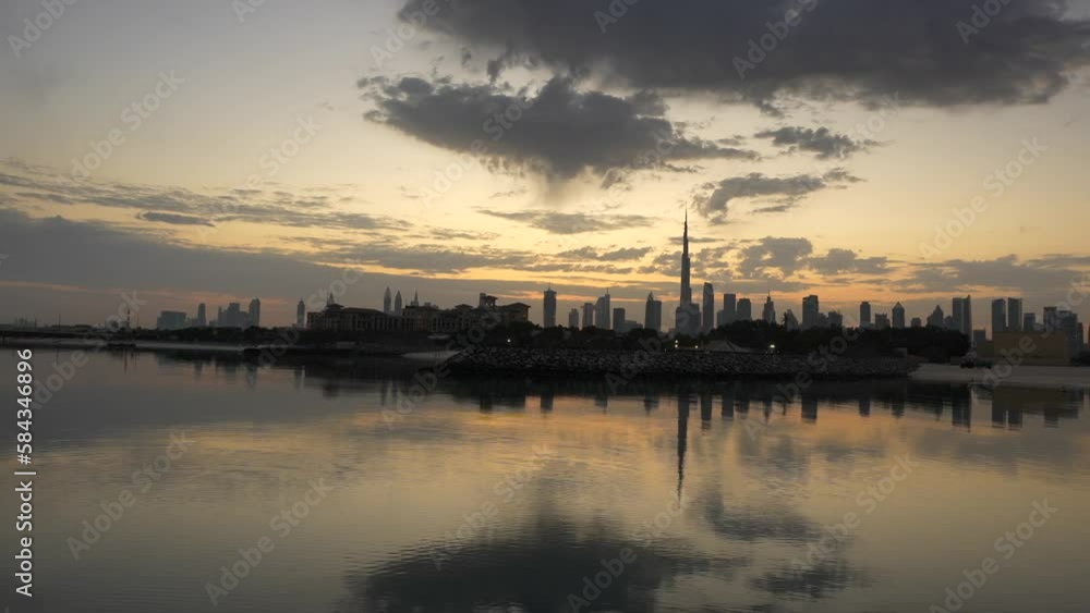 Sunrise over Dubai skyline. Wide angle 4k video with amazing color sky clouds over Dubai skyscraper buildings. Travel to United Arab Emirates. Sunrise over Dubai skyline. Wide angle 4k video with amazing color sky clouds over Dubai skyscraper buildings. Travel to United Arab Emirates.