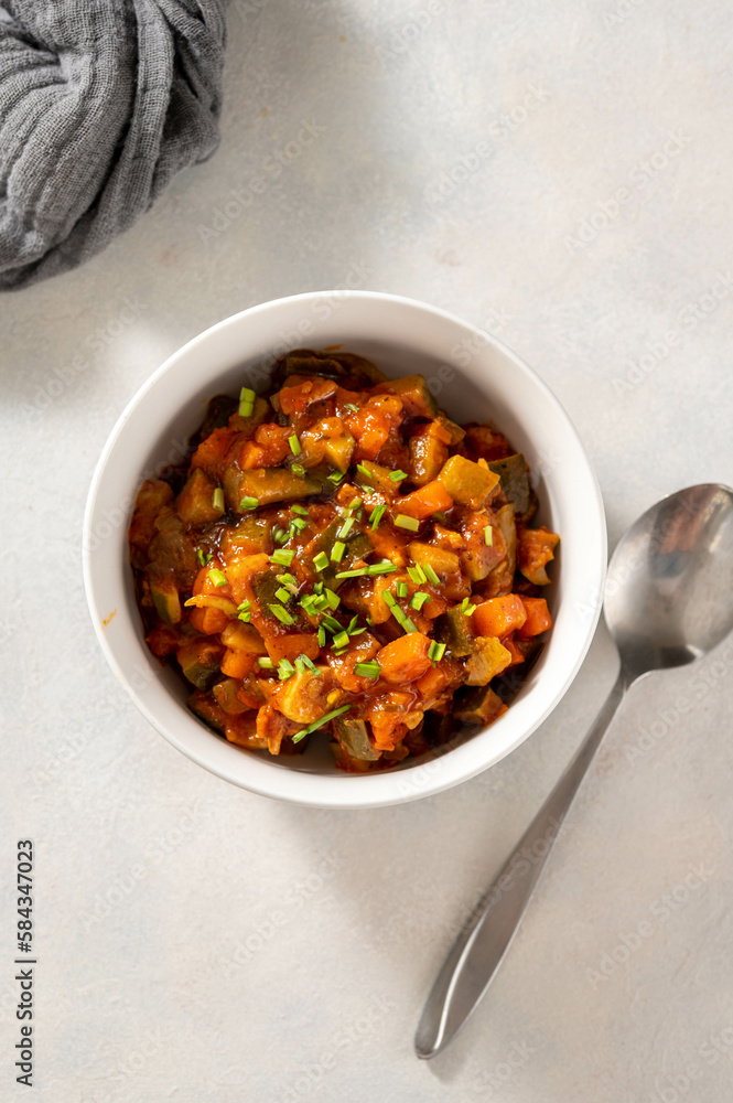 Vegetable stew, vegan healthy food in white bowl. Top view. Vegetable stew, vegan healthy food in white bowl. Top view.