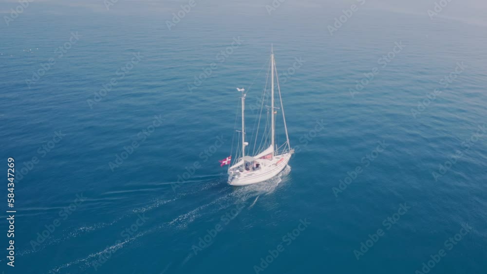 Aerial view of a boat in the sea on a sunny day in Greece Aerial view of a boat in the sea on a sunny day in Greece
