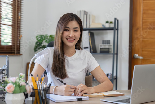 Asian business woman using computer for a online working from home