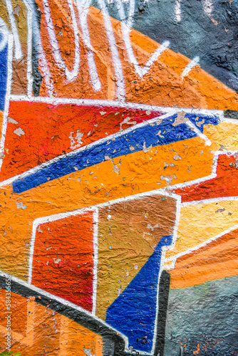 Abstract multicolored graffiti drawings. Wall painting orange and blue. Beautiful design for wallpaper and decoration.