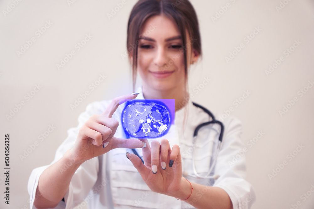 Young female scientist with a hologram of internal organs. Computed tomography hologram in doctor's hands. Futuristic concept of medicine. Young female scientist with a hologram of internal organs. Computed tomography hologram in doctor's hands. Futuristic concept of medicine.